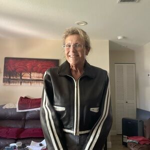 Chic Black Leather Jacket with White Stripes